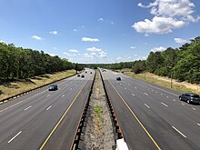 The southbound Garden State Parkway in Lacey Township 2021-05-27 11 45 01 View south along New Jersey State Route 444 (Garden State Parkway) from the overpass for Ocean County Route 614 (Lacey Road) in Lacey Township, Ocean County, New Jersey.jpg
