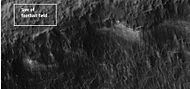 Close-up of a portion of a crater wall indicated in the previous photo. There seems to be grooves in the wall. Picture was taken with HiRISE under HiWish program.