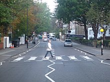 The production team used a street in Cardiff to emulate a well-known Beatles album cover photographed on Abbey Road (pictured). Abbey Road , Paddington, Greater London - panoramio.jpg