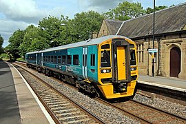 An Arriva Trains Wales Class 158 waits at the Shrewsbury-bound platform.