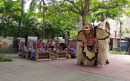 Gamelan ensemble (or gambelan in Balinese term) accompanying barong performance (Bali lion dance) at Garuda Wisnu Kencana cultural complex, Bali, Indonesia.
