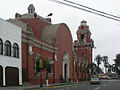 Right side of the Church next to the Seminary.