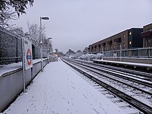 Brockley station's platforms covered in snow after a stormy night, December 2022