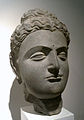 Голова Будды со «средиземноморской» причёской