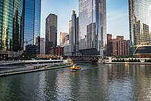 Ferries offer sightseeing tours and water-taxi transportation along the Chicago River and Lake Michigan. Chicago River Morning (44455011711).jpg
