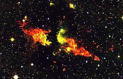 Infrared image of a bipolar outflow. The outflow is driven by a massive young star that was first identified as a radio source and catalogued "DR 21". The outflow itself is known as the DR21 outflow, or MHO 898/899. Image credit: Chris Davis, UKIRT/Joint Astronomy Centre DR 21-col.jpg