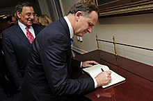 U.S. Secretary of Defense Leon Panetta looks on as New Zealand Prime Minister John Key signs an official guest book before a meeting in the Pentagon on 21 July 2011. Defense.gov News Photo 110721-F-RG147-096 - Secretary of Defense Leon E. Panetta looks on as New Zealand Prime Minister John Key signs an official guest book before a meeting in the Pentagon.jpg