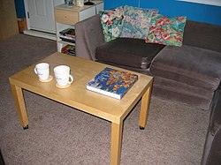 Coffee table book on a coffee table Domestic coffee table in a residential setting.jpg