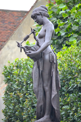 Edward Onslow Ford (1852-1901) - The Muse of Poetry (1891) left, Marlowe Memorial nr Marlowe Theatre, The Friars, Canterbury, UK, October 2012 (8111622455).png