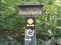 Signpost with urn pictogram (center).  Including the signet of the Frankfurt green belt