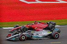 Hamilton's intense battle with Ferrari's Charles Leclerc for the final spot on the podium, at the 2022 British Grand Prix. Ferrari's Charles Leclerc battles for the podium with Mercedes' Lewis Hamilton at the 2022 British Grand Prix at Silverstone. (52196620083).jpg