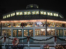 Night view of the 1906 Carousel structure FlyingHorsesExterior.jpg