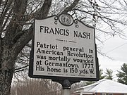 A Highway Historical Marker along a roadway detailing Nash's biography