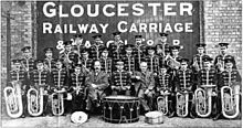 Gloucester Railway Carriage & Wagon Company Band, 1916. Collieries and factories often sponsored their own works bands, and many now-defunct companies survive only in the names of their former bands. Gloucester Railway Carriage & Wagon Company Band 1916.jpg