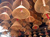 Incense coils hanging from the ceiling of an East Asian temple Incense coils.jpg
