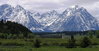 Jackson Lake Dam with Tetons in the backgroud