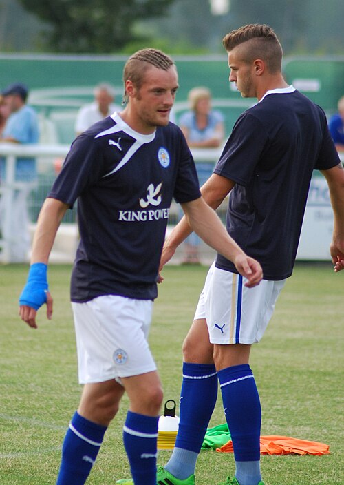 Vardy (left) warming up for Leicester City in 2013