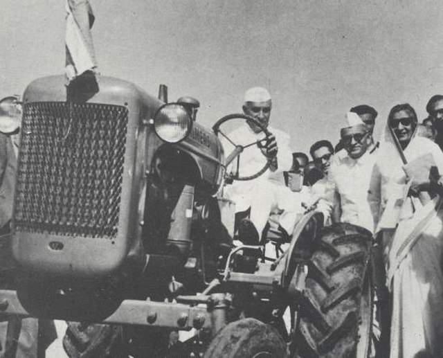 Jawaharlal Nehru driving tractor with Munshi and Rajkumari Amrita Kaur. (From right to left, Munshi wore goggles and Gandhi cap)