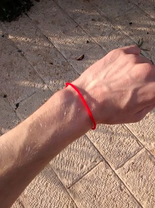 <span class="mw-page-title-main">Red string (Kabbalah)</span> Red string worn to ward off misfortune