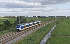 A sprinter from the Nederlandse Spoorwegen near Kampen