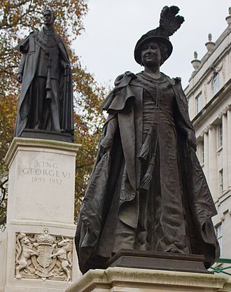 The King George VI and Queen Elizabeth Memorial: A bronze statue of Elizabeth on The Mall, London, overlooked by the statue of her husband King George VI London England Victor Grigas 2011-31 cropped.jpg