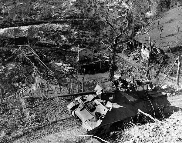 A M10 of the 701st TD Battalion advancing along a mountain road, in an example of the broken terrain common in Italy