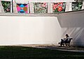 Image 867Man sitting on a bench reading a book, Palácio das Galveias, Lisbon, Portugal