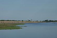 Looking south at Mau Mau Island and the Marine Parkway Bridge from Marine Park. Marine Park td (2019-05-27) 090 - Gerritsen Creek, White Island, Marine Parkway Bridge.jpg