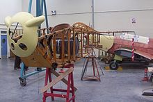 A Sopwith Dolphin under restoration in 2003 with the Miles Mohawk behind MichaelBeethamConservation-02.jpg