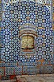 The shrine is covered in blue tile-work that is typical of Multani style.