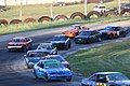 Norway Speedway 2012 DQ Dogs racing in Turn 4.jpg