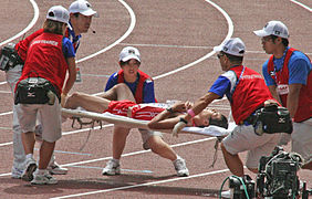 Japanese athlete is carried away after the 50 km walk.