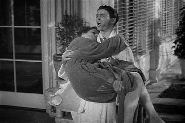 Mike carries Tracy into the house after a midnight dip.