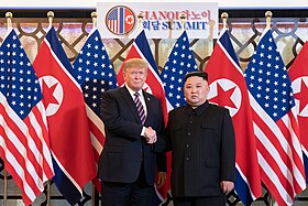 Handdruk tussen Donald Trump en Kim Jong-un.