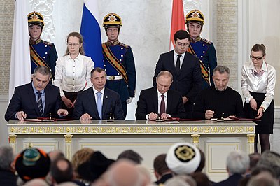 Vladimir Putin and pro-Russian Crimea leaders sign the Treaty on Accession of the Republic of Crimea to Russia in 2014