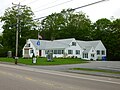 Raynham Public Library, located at 760 South Main Street, Raynham, Massachusetts 02767. Southeast (front) and northeast sides of building shown.