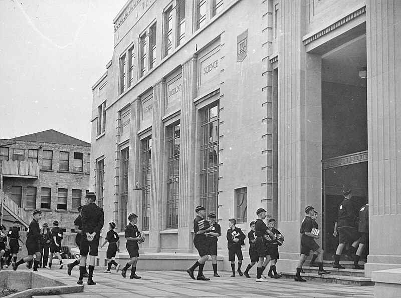 File:Rongotai College boys moving library books.jpg