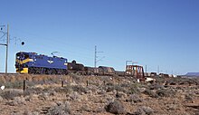 E7008 in Blue Train livery near Die Put in May 1985 SAR Class 7E E7008 BT.jpg