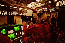 Allen on the flight deck of Columbia during reentry of STS-62 STS062-41-025.jpg