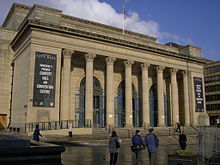 Sheffield City Hall, a Neo-classical design with a large portico and prominent pillars which were damaged when a bomb fell on the ajoining Barkers Pool during World War II. It is a grade II* listed building
