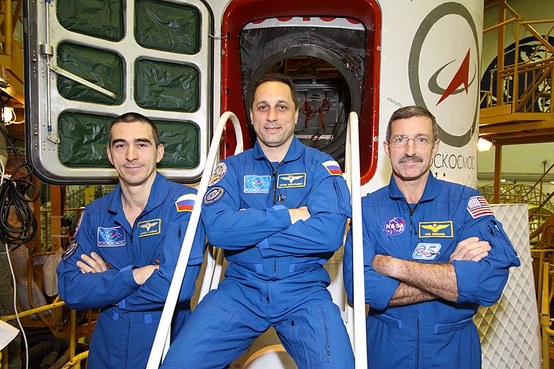 File:Soyuz TMA-22 crew in front of their spacecraft.jpg