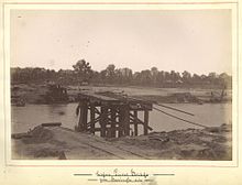Flood damaged Logan River crossing, 1887 StateLibQld 1 254264 Flood damage to the Logan River railway bridge, looking from the Beenleight side, Beenleigh, 1887.jpg