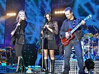 (L-R) Sharon, Andrea and Jim Corr in concert