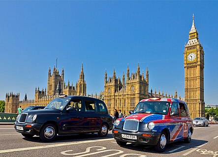 Two iconic black cabs with Big Ben in the background