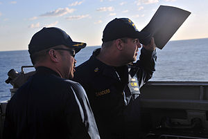 US Navy 120120-N-OP638-015 Cmdr. Martin F. Arriola, left, commanding officer of the Arleigh Burke-class guided-missile destroyer USS Porter (DDG 78.jpg