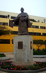 Monument of Fray Thomas de San Martin, manager of the foundation of the National University of San Marcos, outside the "Pedro Zulen" Central Library. Unmsm monumentofraytomasdesanmartin.JPG