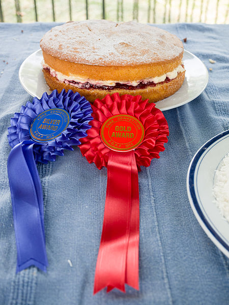 Competitive baking, such as making Victoria sponge (pictured), is part of the classic English village fête which inspired the series.