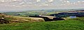 View from Holme Moss north up the Holme Valley over Holmfirth, near Huddersfield in West Yorkshire, England. The village of Holme is shown to the left of the Brownhill reservoir, with Yateholme reservoir shown further right and on the horizon is the Emley Moor Television Transmitter.JPG