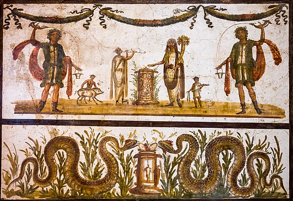 Fresco in Pompeii depicting two lares with rhyton and situla, genius offering at an altar, flute-player, servant with vase and servant pushing a pig to the altar; below: altar with fruits and eggs between two snakes ("agathodaimones")