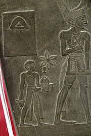 King Narmer (right) followed by his sandal-bearer. Detail from the Narmer Palette, Cairo Egyptian Museum. Agyptisches Museum Kairo 2019-11-09 Narmer-Palette 05.jpg